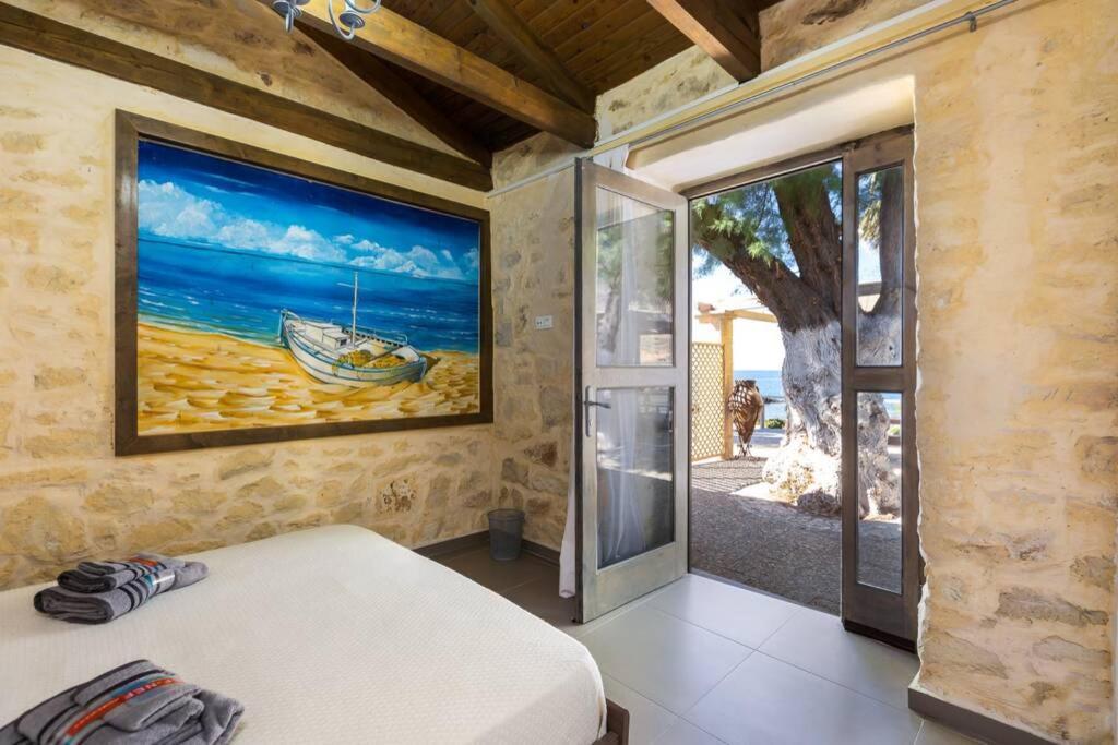 Villa Proto Helidoni - A cozy beachfront Villa Petres  Esterno foto